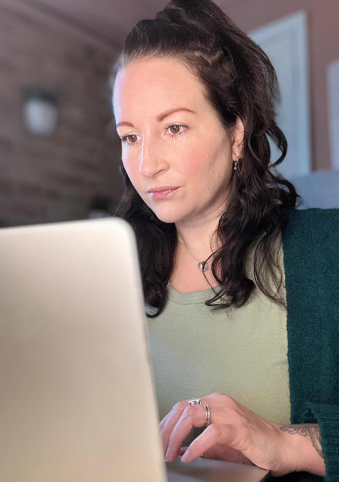 Lucy Clarke working at her laptop